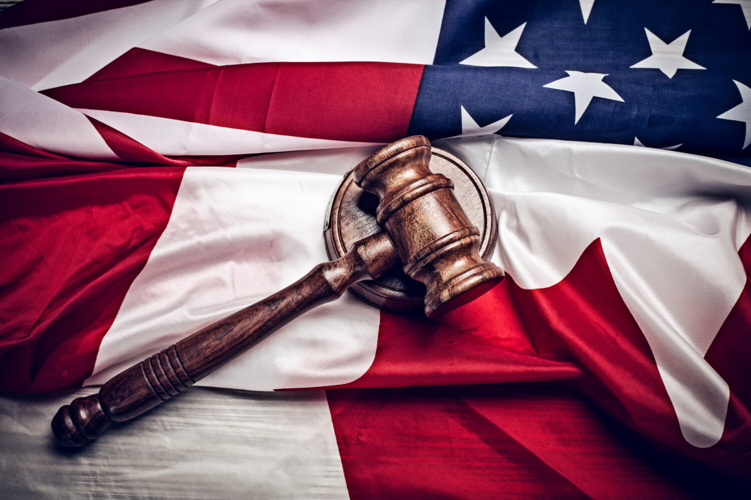 stock-photo-the-judge-gavel-and-background-with-usa-flag-531398749