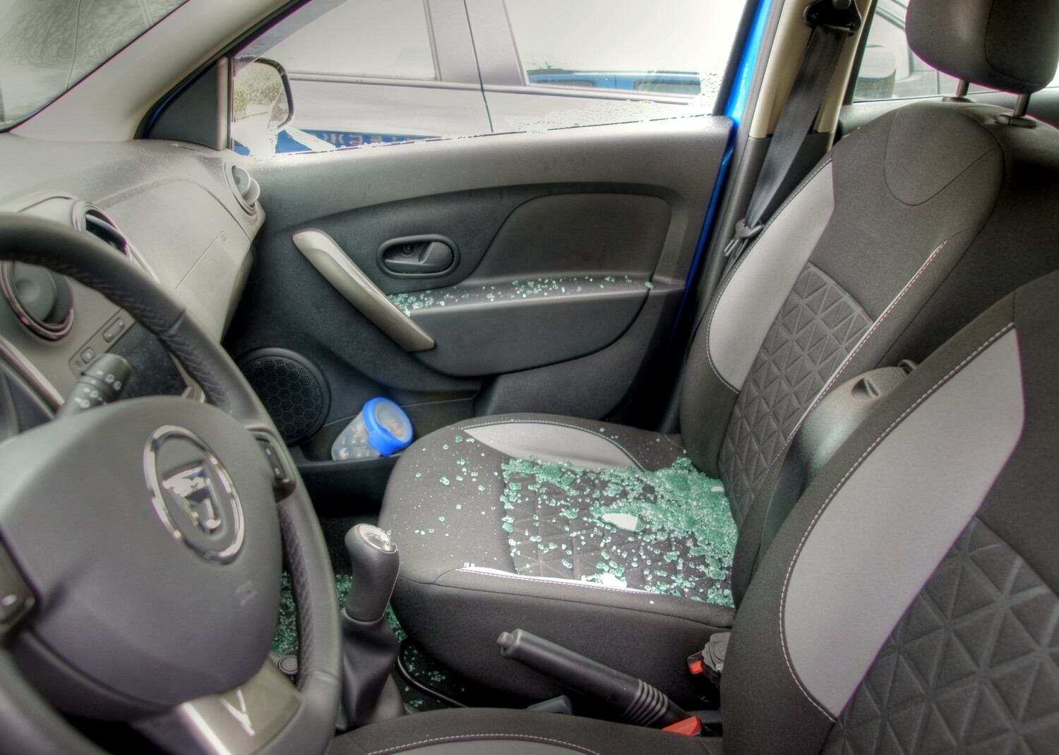 stock-photo-thiefs-have-broken-a-car-window-to-steel-items-inside-and-the-glass-is-spread-all-over-the-car-230798356